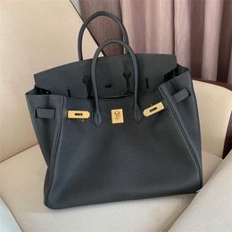 Top Luxurys Leather Handbag Bag Home Togo Cowhide Lychee Grain Genuine Portable Lock Buckle Black Versatile Casual Light Luxury