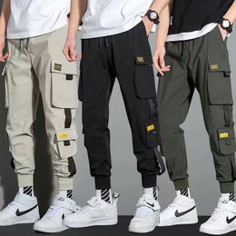 Men's Pants Thin Streetwear Casual Pants Men Ribbons Harem Jogging Pants Male Slim Fit Spring Cargo Pants Multi-Pockets Women Trouser Jx1 230911