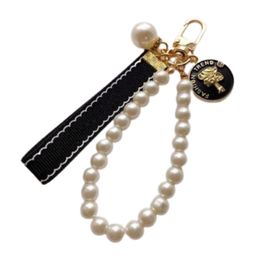 Designers Fashion Keyring Keychains Luxury Brands Pearl Handmade Keyrings Women Lovers Couple Bags Cars Key Chains Lanyards226T