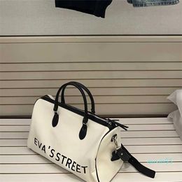 Canvas portable travel bag for both men and women fashionable wide shoulder strap for cross body short distance travel large bag