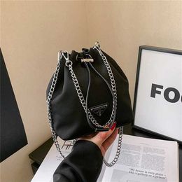 50% off clearance sale Triangle nylon canvas mini niche bucket double chain drawstring single shoulder handbag female letter bag model 542