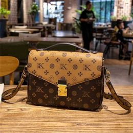 50% off clearance sale Hong Kong Counter Genuine Leather Large Capacity Mailman Women 2023 New Summer Single Shoulder Crossbody for Old Flower Women's Bag model 542