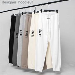 Mens Tracksuits Mens pants womens casual pants long elastic band solid color black and white gray letters pressed adhesive fashionable casual clothing size m l xl xxl