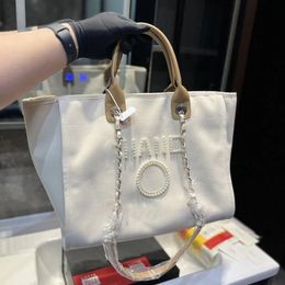 Tasarımcı çanta çanta yaz plajı çanta omuz çantaları glitter ofis çanta kaliteli klasik kadın tuval çantalar düğmeli retro bayanlar lüks çanta çapraz gövde