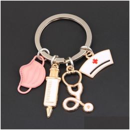 Keychains Lanyards New Doctor Keychain Medical Tool Key Ring Injection Syringe Stethoscope Nurse Cap Medico Gift Diy Jewelry Handmade Dhga8