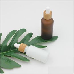 Packing Bottles Wholesale Frosted Amber White Glass Dropper Bottle 15Ml 30Ml 50Ml With Bamboo Cap 1Oz Wooden Essential Oil Drop Delive Dhyb9