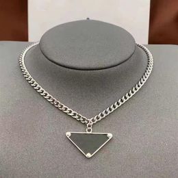 Classics Designer Necklace Women Men Chains Luxury Jewellery Black White P Triangle Pendant Party Hip Hop Punk Names Statement Gold 218N