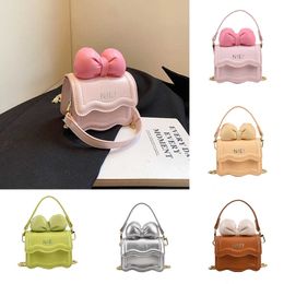 Autumn New Korean Edition Mini Children's Girls' Shoulder Bag Bow Chain Crossbody Small Bag Parent Child Bag Women's Bag 230915