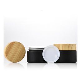 Packing Bottles Wholesale Black Frosted Glass Jars Cosmetic Jar Bottle With Woodgrain Plastic Lids Pp Liner 5G 10G 15G 20G 30 50G Li Dhjnt