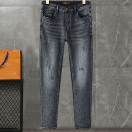 Brand-name jeans Fashion Brand-name men's jeans all match Grey jeans with a fashion LOGO