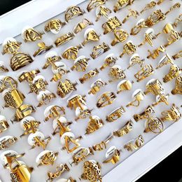 100pcs lot Laser Cutting Rings for Women Styles Mix Gold Stainless Steel Charm Ring Girls Birthday Party Favour Female Beautiful Je307Q