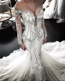 Luxury Crystals Beaded Mermaid Wedding Dresses Long Sleeves Lace Appliqued Chapel Train Bride Formal Gowns Ivory Tulle Sheer Neck Elegant Vestido De Novia 2023
