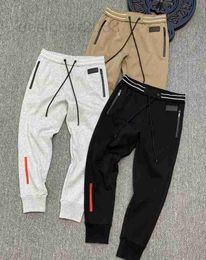 Pantaloni da uomo Autunno e inverno pantaloni firmati di alta qualità materiale elastico piccolo piede vita stretta per il tempo libero sport di lusso da uomo DKWR