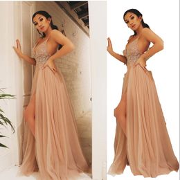2023 Sexy Prom Dresses Champagne Spaghetti Straps Sleeveless Illusion Empire Crystal Beading High Side Split Floor Length Tulle Open Back Party Dress Evening Gowns