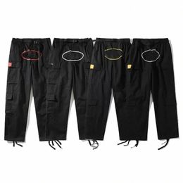 23SS Pantaloni da uomo Cargo Mens Streetwear Hip Hop Pantaloni casual stampati retrò Militari Retro multitasche Dritto High Street Tuta ampia Coppia