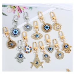 Party Favour Ups Creative Devils Eye Key Buckle Blue Bag Pendant Oil Drip Door Cross Border Jewellery Drop Delivery Home Garden Festive Dhvkn