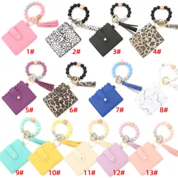 Keychain Bracelet Wristlet pendants Silicone Beaded Key Ring Bracelet with Card Wallet Elastic Keyring and Tassel Bangle for Womens ups