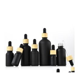 Packing Bottles Matte Black Coated Glass Dropper Bottle Boston Round Essential Oils Per With Wood Grain Plastic Cap Drop Delivery Of Otdqa