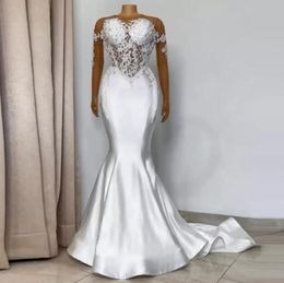 2023 Sexy Mermaid Wedding Dresses Crystal Beads Jewel Neck Illusion Lace Appliques Long Sleeves Cutaway Sides Satin Bridal Dresses Custom Vestidos De Novia