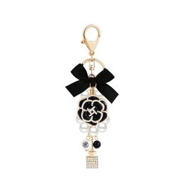Key Rings Personality Bowknot Imitation Pearl Per Crystal Bottle Iron Tower Chain Keychain Car Bag Charm Accessories Girl Keyring Dr Otdvy