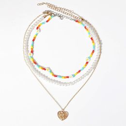 Pendant Necklaces European And American Multi-layer Sweater Chain Creative Stacking Daisy Rice Beads Heart-shaped Embossed Pearl NecklacePen