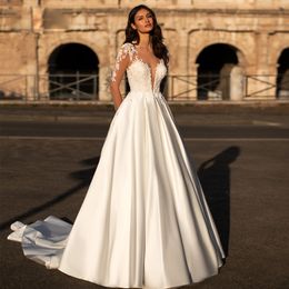 Abito da sposa con perline in pizzo a maniche lunghe con illusione Collo trasparente Abiti da sposa Abiti da sposa sexy con bottoni sul retro Sposa in raso