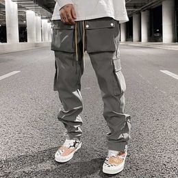 High Street Multi-pocket Casual Trousers for Men and Women Side Breasted Drawstring Cargo Pants Harajuku Solid Loose Pants T230806