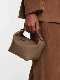 The Row Head Layer Cowhide Spring/Summer Popular Design Premium Texture Lunch Box Bucket Bag Foreign style handbag