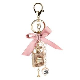 Keychains Lanyards Fashion Imitation Pearl Per Bottle Keychain Car Key Ring Women Bag Charm Accessories Cute Bow Chain Creative Keyr Dhkfq
