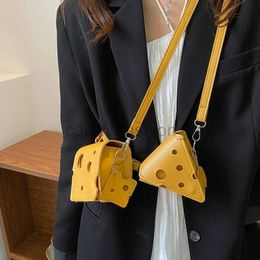 Cross Body 2023 New Fashion Trend Cute Mini Hole Cheese Triangle Lipstick Earphones Cross Body Change Small Square Bag caitlin_fashion_bags