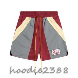 RHUDE red Europe and the United States fashion brand Colour matching micro standard tethered casual shorts men and women high street beach sports five quarter pants
