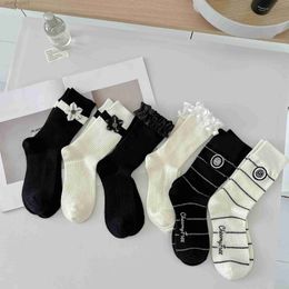 Black and white socks children's new autumn and winter lace mid tube socks cute personality college wind flower sweet beauty socks