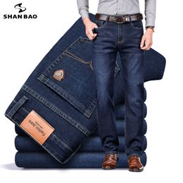 Mens Jeans SHAN BAO autumn spring fitted straight stretch denim jeans classic style badge youth mens business casual trousers 230817