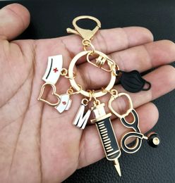 Key Rings New Drip Oil Keychain Doctor Medical Tool Stethoscope Syringe Mask Ring Nurse Student Gift 26 Letters Chains Drop Delivery Smtas