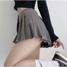 Versão coreana de saias chiques bebês cintura alta cor pura emagrecimento estilo preppy redução de idade anti revelador