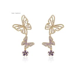 Greek designer hollowed out butterfly super immortal gentle temperament tassel earrings new simple and fashionable exquisite earrings for women