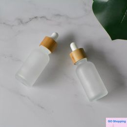 Quality Cosmetic Packaging Container Supply 30ml Natural Bamboo Wooden Dropper Bottle Frosted Glass Dropper Bottle with Wood Cap