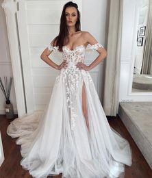 2023 Sexy Bobemian A Line Wedding Dresses Off Shoulder Appliques Lace Tulle Short Sleeves Sheer Top Mermaid Bridal Gowns High Side Split Overskirts