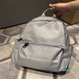 2023 Simple and Versatile Multi compartment Backpack with Leisure Oxford Fabric Lightweight Travel Style Backpack