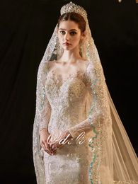 Vestido de noiva sereia de manga comprida árabe Dubai moderno novo 2023 romântico lindo frisado renda princesa vestido de noiva feito sob encomenda apliques transparentes