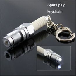 Key Rings 1Pcs Mini Keychain LED Flashlight Key Chain Alloy Chrome Silver Spark Plug Keychain Car Motorcycle Parts Keyring 5.8c