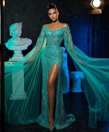 Green Mermaid Prom Dresses Long Sleeves V Neck Capes Appliques Sequins Floor Length Celebrity Lace Hollow Side Slit Evening Dress Bridal Gowns Plus Size Custom Made