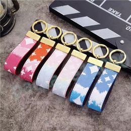 Designer Zinc Alloy leather keychain - Exquisite Brown Keyring for Women and Men - High Quality 2023 Luxury Car Key Ring with Letter Detail - Unisex Lanyard in Gold and Black Metal - Small Jewelry (Lov 02)