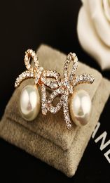 Fashion exquisite zircon bow pearl Stud earrings highgrade 18K goldplated hypoallergenic female cute girl earrings8263358