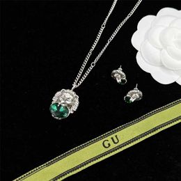 2023 Designer New family/ujia crystal old three-dimensional lion head necklace double G letters silver needle earrings female light luxury ins