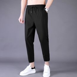 Men's Pants Men's Summer Thin Pants Korean Trend Nine Straight Tube Loose Ice Silk Elastic Sweatpants For Boys Spring And Autumn Student 230320