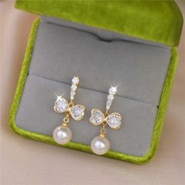 Charm New French Luxury Design Zircon Earrings Delicate Full Zircon Pearl Water Drop Temperament Premium Sense Earrings Long Earrings G230320