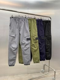 2022 Stati Uniti pantaloni da uomo pantaloni casual hip hop viaggi primaverili cuciture di alta qualità colore a contrasto bussola bastone pantaloni cargo multi-tasca in tessuto
