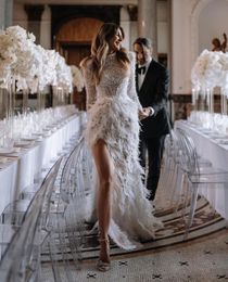 Luxury Mermaid Wedding Dresses Long Sleeves High Neck Pearls Appliques Sequins Beaded Feather Train 3D Lace Side Slit Floor Length Lace Bridal Gowns Custom Made