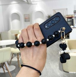 Cell Phone Cases Cute Beads Wrist Band Abstract Balloon Dog Pendant Leather Phone Case For Samsung Galaxy Z Fold 4 3 2 1 Hard Slim Cover Z0324